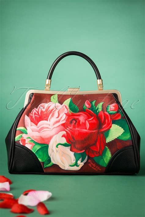 The 1950s vintage style floral kitchen aprons give out such cheerful holiday vibes and old fashioned fun. 50s Red Paris Floral Retro Handbag in Brown