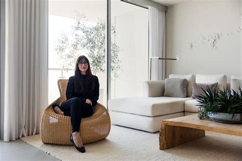 Sarah In Black On Whicker Woven Chair In Minimalist White Living Room