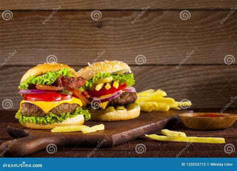 Fresh Delicious Burgers On A Wooden Background Stock Photo Image Of
