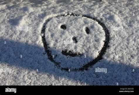 Smiley Face Imprinted Into Snow Hi Res Stock Photography And Images Alamy