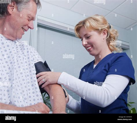 Nurse Taking Blood Pressure High Resolution Stock Photography And