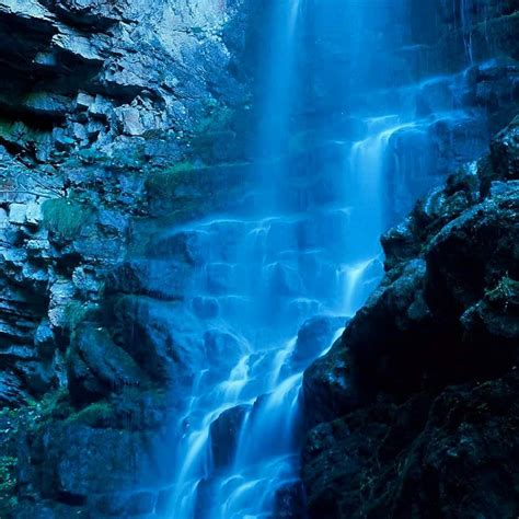 Blue Waterfall In A Deep Forest Shadow Of Croatian Mountains