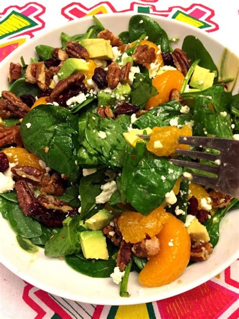 Juice remaining orange (you will need 1/4 cup juice). Spinach Salad With Candied Pecans, Dried Cranberries ...