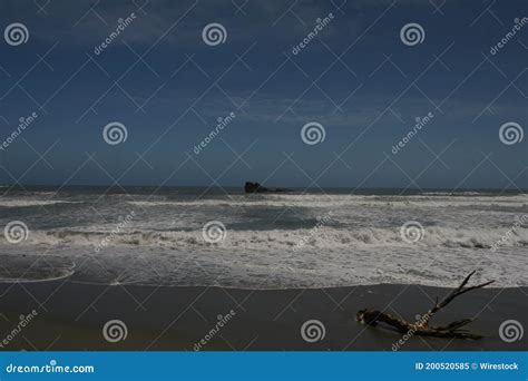 Ocean Waves Hitting The Sandy Beach In New Zealand Stock Image Image
