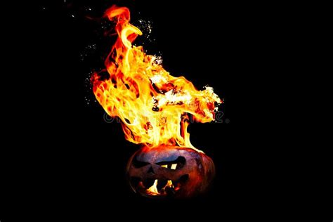Halloween Pumpkin On Fire Isolated On A Black Background Stock Image