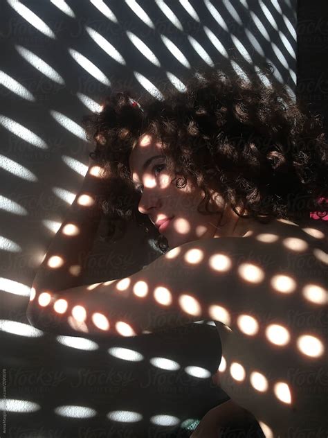 A Beautiful Woman In Dot Shadows On Her Back By Stocksy Contributor Anna Malgina Stocksy