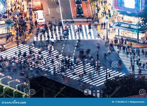 Pedestrians Cross The Shibuya Scramble Crosswalk In Tokyo Japan Stock