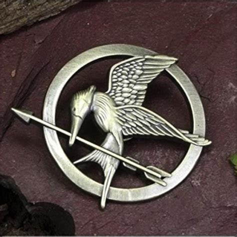 neca the hunger games prop replica mockingjay pin pack of 2 etsy in 2021 mockingjay pin