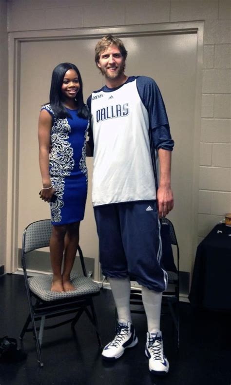 Dallas Mavericks Star Dirk Nowitzki And Olympic Gold Medal Gymnast Gabby Douglas Blue Dress