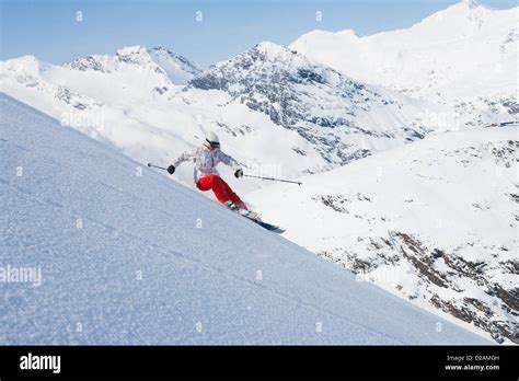 Skier On Snowy Slope Stock Photo Alamy