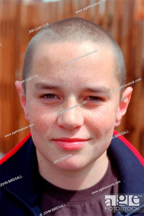 Portrait Of Teenage Boy With Shaved Head Stock Photo Picture And