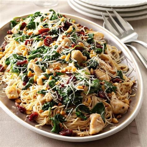 This chicken and angel hair pasta includes broccoli, sliced carrots, and parmesan cheese. Angel Hair with Chicken & Cherries Recipe | Taste of Home
