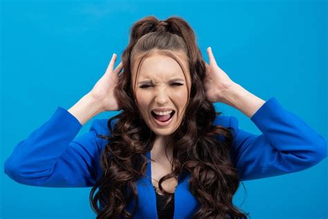 Premium Photo Screaming Hate Rage Crying Emotional Angry Woman Screaming On Blue Studio Background