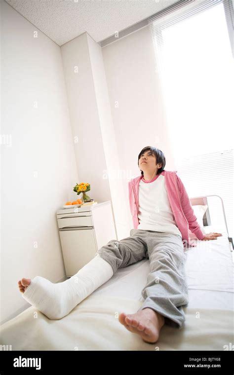Man With Broken Leg Sitting On A Hospital Bed Stock Photo Alamy