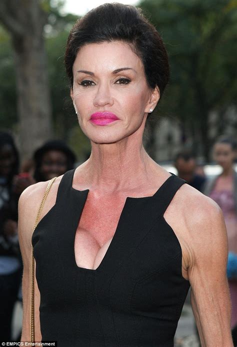 Janice Dickinson Parades Her Very Sinewy Arms In Plunging Tight Dress At Paris Fashion Week