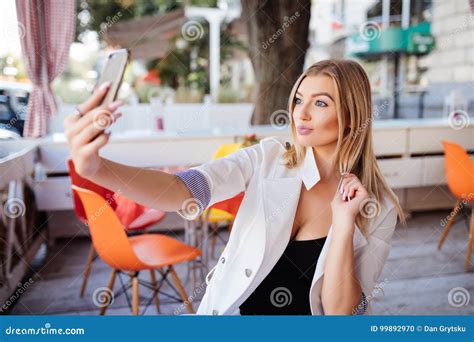 Gorgeous Smiling Woman Making A Selfie While Having A Cup Of Coffee