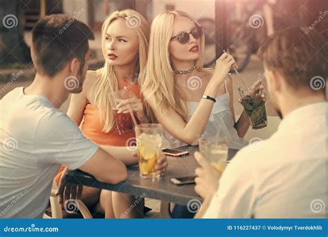 Group Of Party People Two Couples With Cocktails In Bar Stock Image Image Of Flirting People