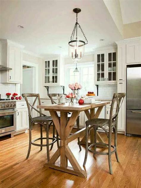 A kitchen island is a really useful addition to a kitchen and might be used for any number of activities for the part of the island that serves the seating area there are three generally accepted height options which are (smallest to tallest) table height, countertop height, bar height. Love this rustic kitchen table at bar height. Traditional ...