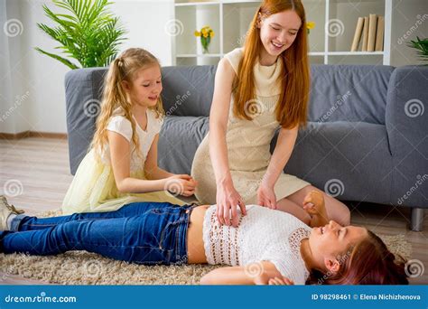 mother and two daughters playing and tickling stock image image of pretty laugh 98298461