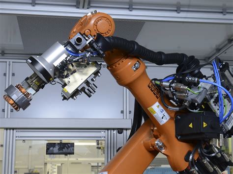 KUKA robot with camera supports assembly process at Miele | KUKA AG