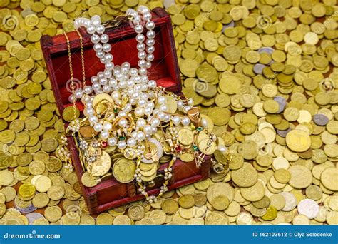 Vintage Treasure Chest Full Of Gold Coins And Jewelry On Background Of