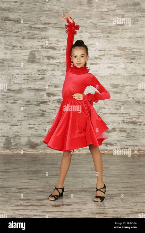 Beautifully Dressed Little Girl Dancing In Studio Stock Photo Alamy