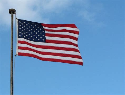 Flag United States Free Stock Photo A Us Flag Flying In A Blue Sky