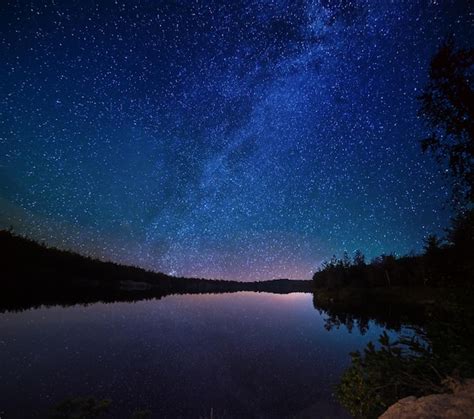 Premium Photo Lake At Night With Amazing Starry Sky And Reflections