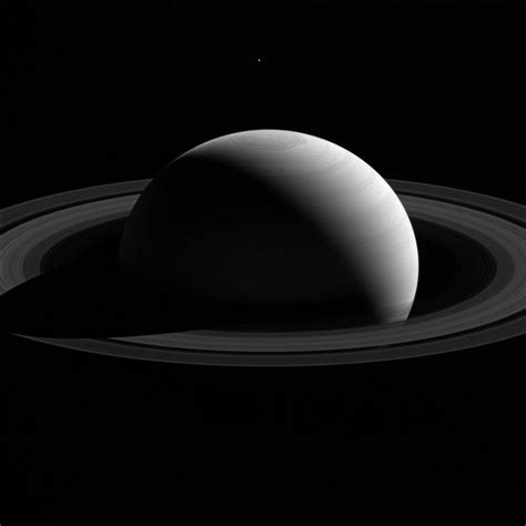 A New Image From Nasas Cassini Spacecraft Creates The Optical Illusion That Saturns Icy Moon
