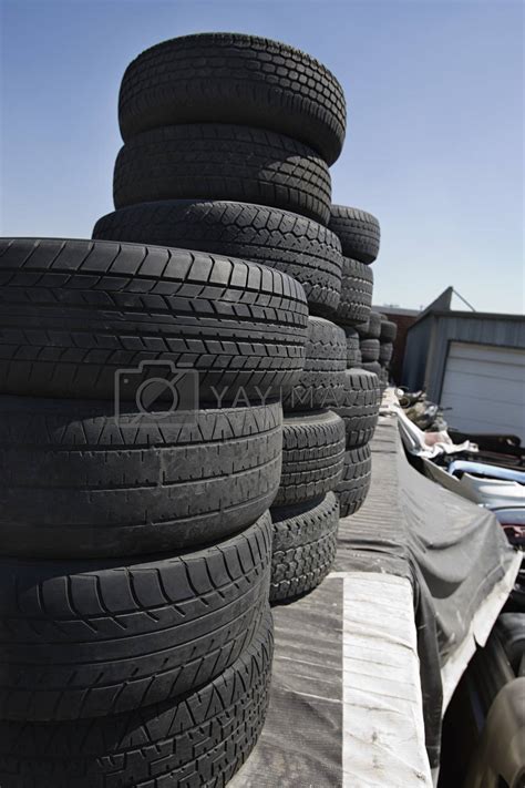 Stack Of Tires In Junkyard By Moodboard Vectors And Illustrations With