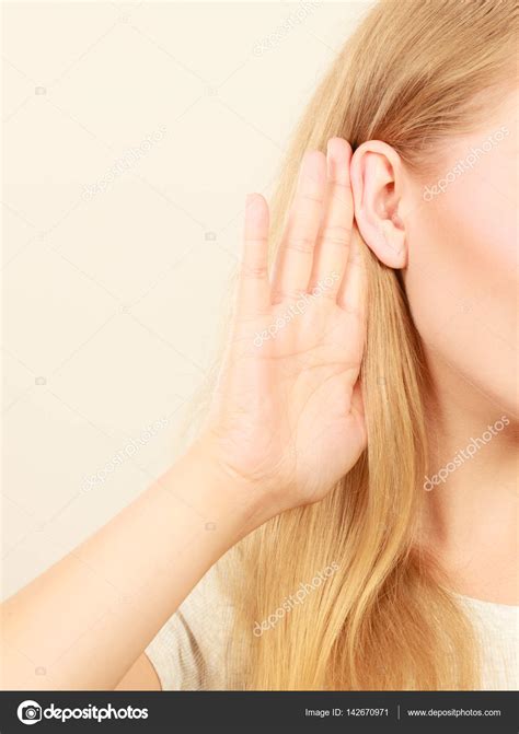 Woman Putting Hand Ear To Hear Better Stock Photo By ©voyagerix 142670971