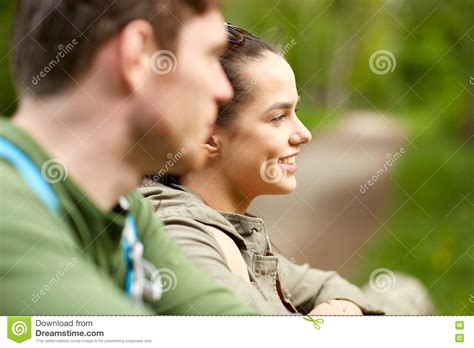 smiling couple with backpacks in nature stock image image of journey cheerful 75675543