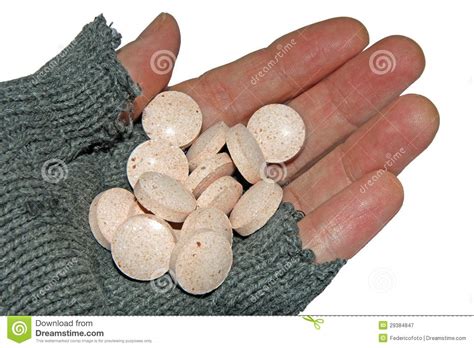 Hand Of Poor Man Holding A Handful Of Tablets Royalty Free