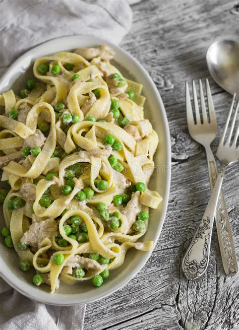 Homemade Pasta With Green Peas Chicken Breast And Cream Sauce Stock