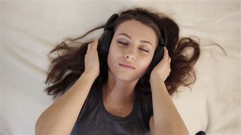 Pretty Girl In Love Listening Music In Bed Stock Footage Video 7728502