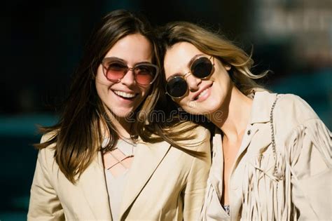 Portrait Of Two Women Laughing Girls Friends In Sunglasses Outdoor