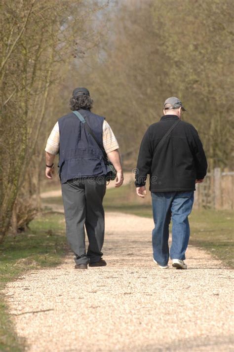 Two Men Walking Stock Image Image Of Couples People 2222551