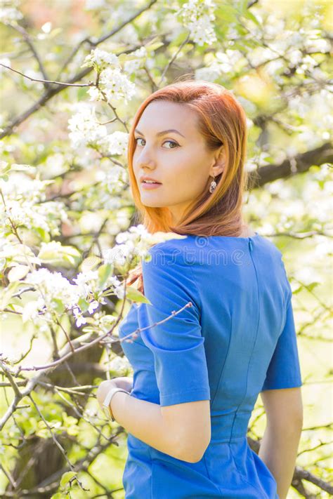 Beautiful Young Red Haired Girl In Blue Dress Among Spring Flowe Stock Image Image Of