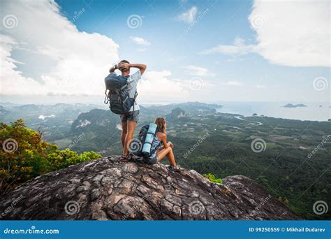 Two Hikers Relax On Top Of A Mountain Stock Image Image Of Sitting