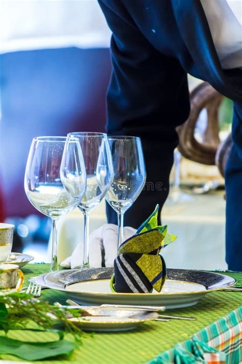 Waiter Decorate And Setting Party Dinner Table In Restaurant Stock