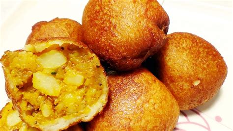 The surface should be hard, but sticky. How to Make Bread Bonda Recipe recipe | Recipe Rasoi