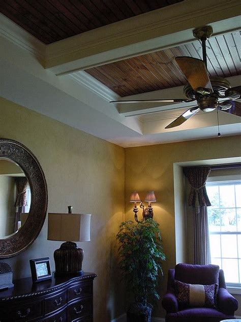 Tray ceilings enhance ordinary ceiling lines to create architectural interest. faux leather walls and custom tray ceiling | Faux leather ...