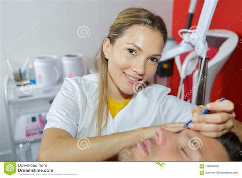 Beautician Giving Facial Makeover To Male Customer Stock Image Image