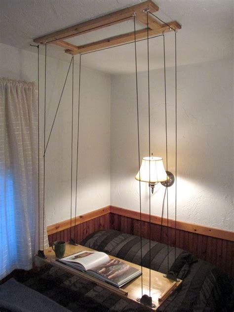 If you have exposed ceiling beams, hanging the bed just got a lot easier. Paracord and Pulley Hanging Table | Hanging furniture ...