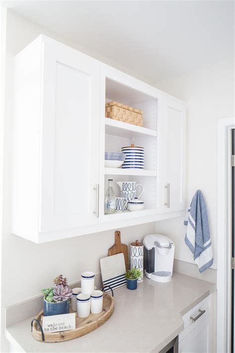 It is also great in your pantry to get to those hard to reach cans and don't forget your bathroom cabinets. Contemporary White Kitchen Cabinet Detail With Open ...