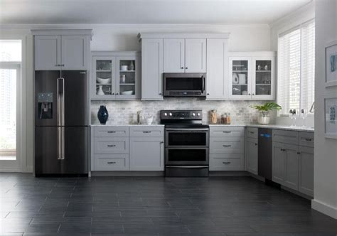 Do you suppose beige kitchen cabinets with white appliances appears to be like nice? Kitchen: Darker stainless steel appliances via Samsung ...