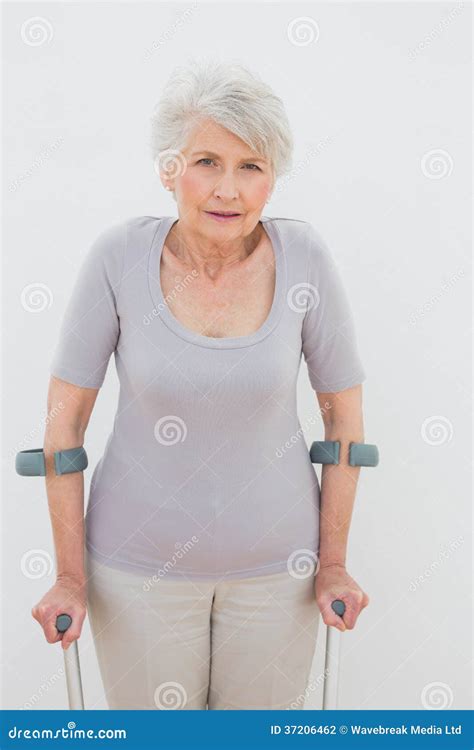 Portrait Of A Senior Woman With Crutches Stock Photo Image Of Senior