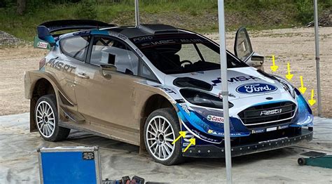 37 in front tapered to 31 with vertical fences. Modifications of the Ford Fiesta WRC's front aero package ...