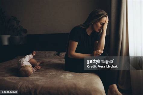 moms crying in bed photos and premium high res pictures getty images