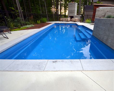 Natural Stone Coping On A Fiberglass Pool With Concrete Patio Pool